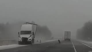 Dashcam footage shows a semi-truck sliding off I-469 in Fort Wayne, IN