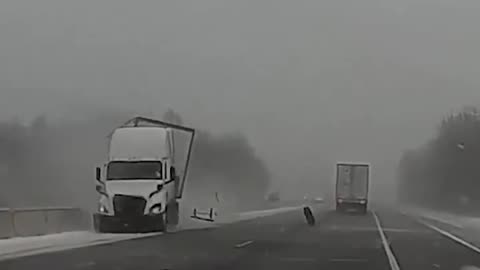Dashcam footage shows a semi-truck sliding off I-469 in Fort Wayne, IN
