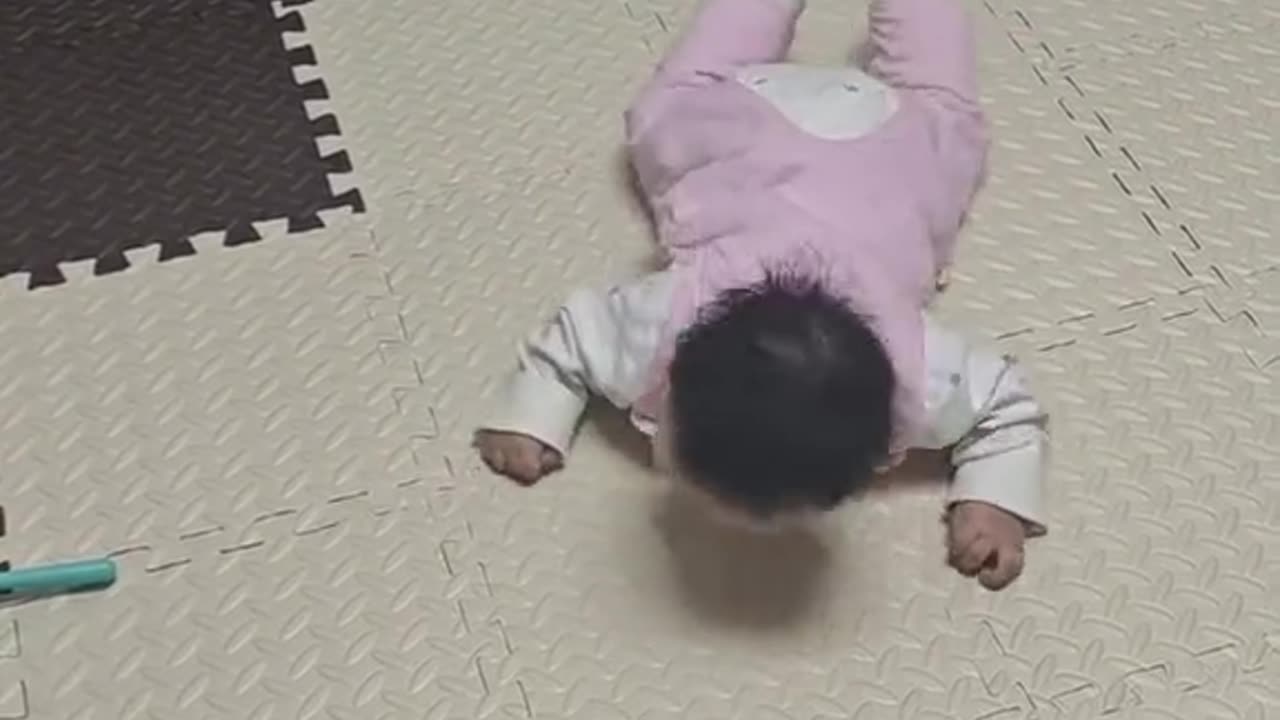 cute baby imitating his toy