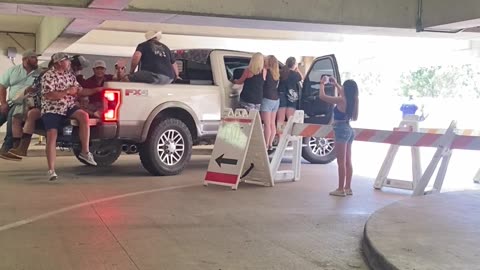 Crowd Helps Weigh Down Too-Tall Truck