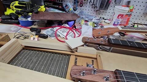 Fine tuning the neck construction of the washboard guitar.
