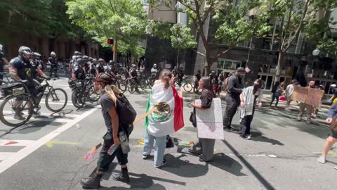 Liberal women cry after being pepper sprayed, for harassing police officers.