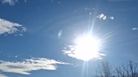 Created material, "clouds", in the atmosphere with the white sun(blue hue)
