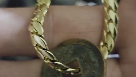Removing 708-958 AD Japan cash coin for case