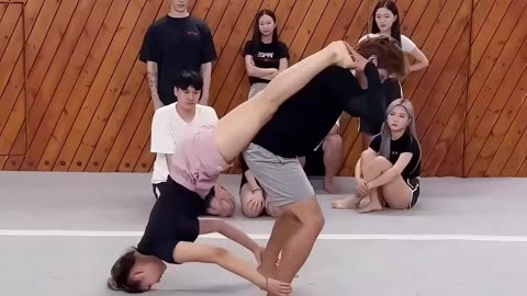 Two Awesome Talented Acrobat Girls on Beach with High Difficulty Balance Action