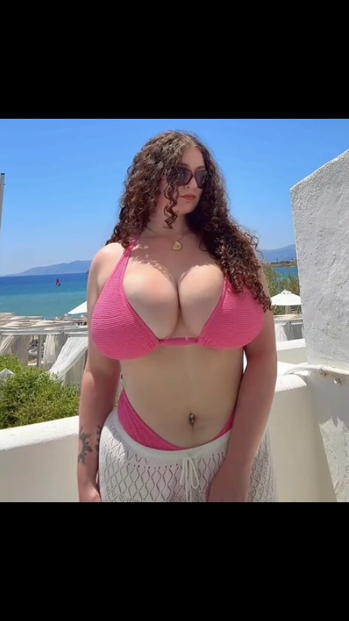 More massive redhead bikini jugs