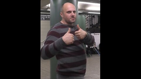 Luodong Massages White Man In Striped Shirt In The Subway Station