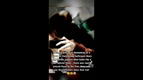 Ghost captured in back of two girls