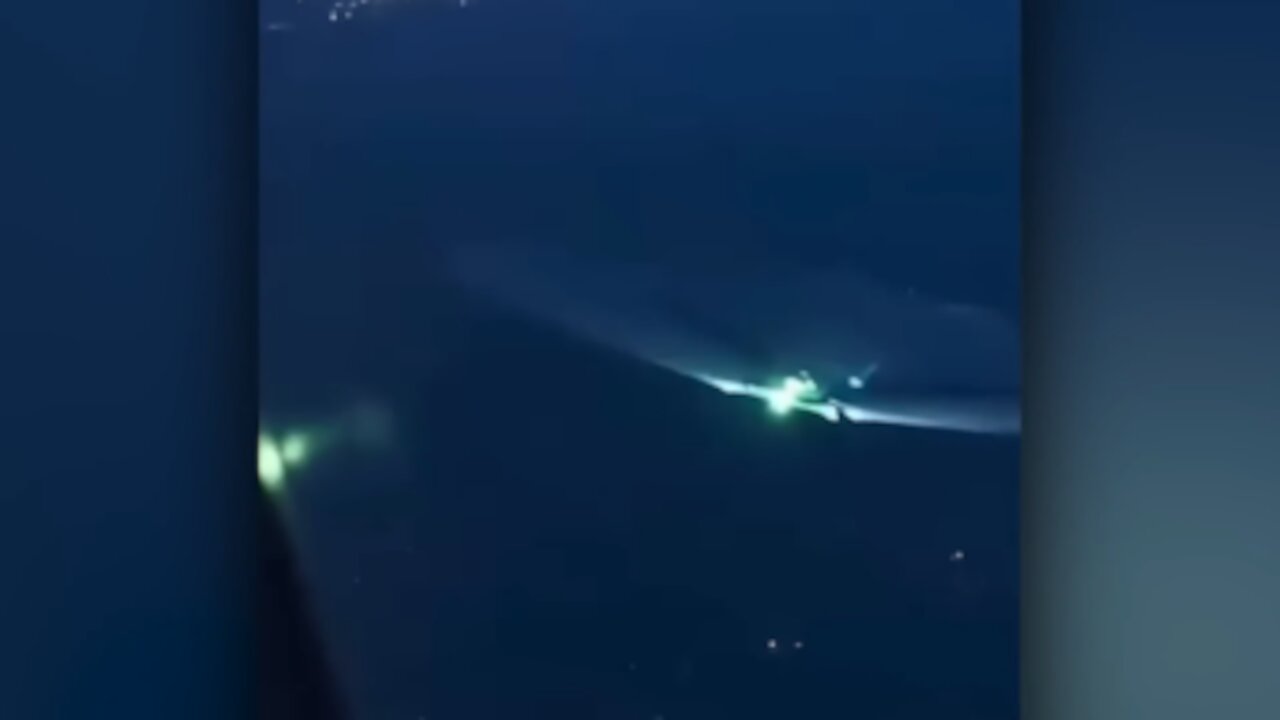 Large UFO Flies Near Plane