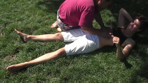 Luodong Massages Skinny White Woman With Short Hair On The Grass