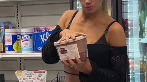 Lady licks icecream then puts it back in freezer in the store