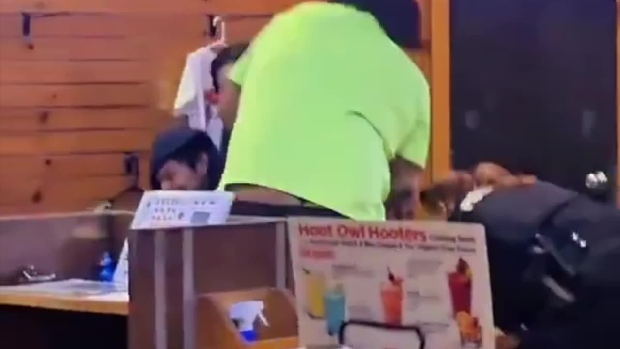 Two female police officers against a short, roughly 130-pound man.