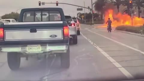 No helmet. No safety gear. Just barreling into an upcoming intersection at full speed.