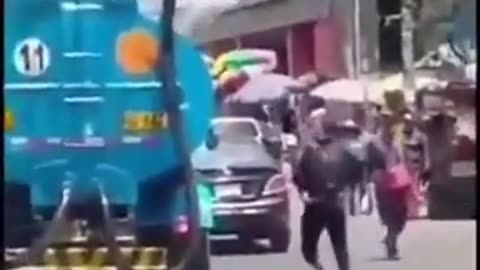 Dude Pissing In public gets a surprise from a complimentary water canon wash lol
