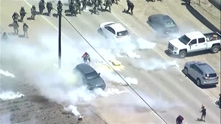 Protesters, immigration agents clash at California marijuana farm raids