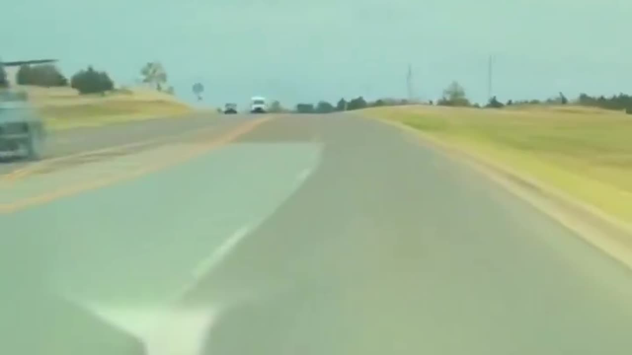 Tesla Full Self-Driving car dodges a plane falling from the sky