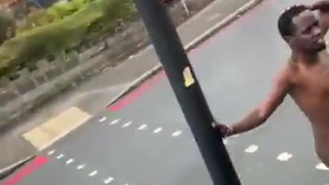 In Walsall, in the West Midlands, an asylum seeker walks down the road with no clothes on