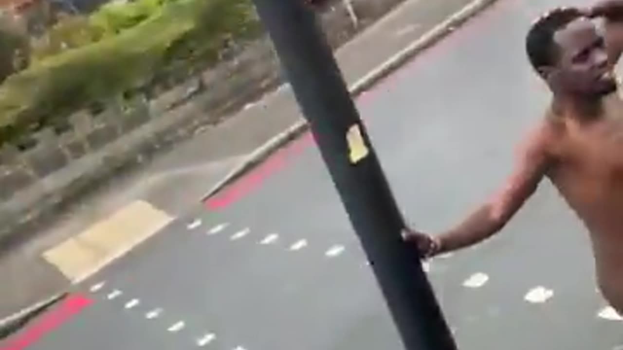 In Walsall, in the West Midlands, an asylum seeker walks down the road with no clothes on