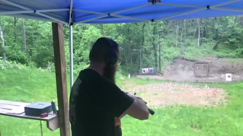 AK-47 muzzle blast deflecting rain