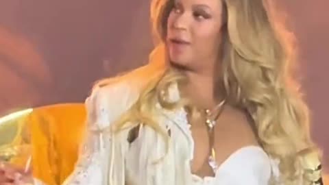 Beyoncé reacts to robot missing her whiskey glass during concert on May 9.