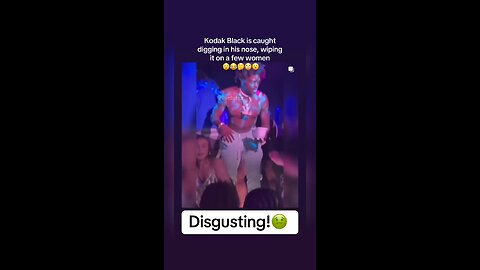 The rapper kodak black is caught , digging up his nose,wiping it on people head!