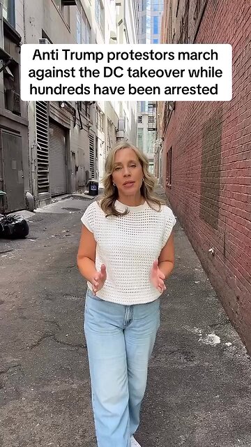 Captioned - Anti-Trump protestors march in DC