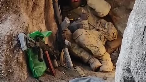 Ukrainian soldiers barely avoid Russian bomb as they hide in a trench