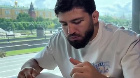 UFC star Arman Tsarukyan eats Black Beluga caviar in Red Square Moscow. Each bite is like 300 bucks.