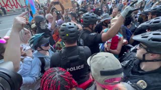 Liberal protestors surround, harass and block woman; police forced to protect her
