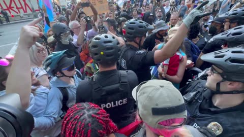 Liberal protestors surround, harass and block woman; police forced to protect her