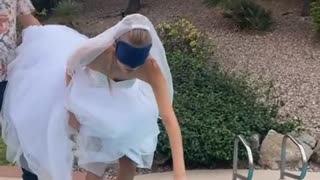 Bride doesn't know she's going in the pool