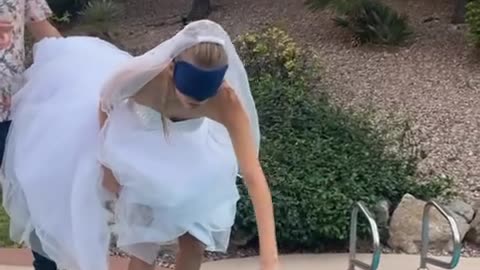 Bride doesn't know she's going in the pool