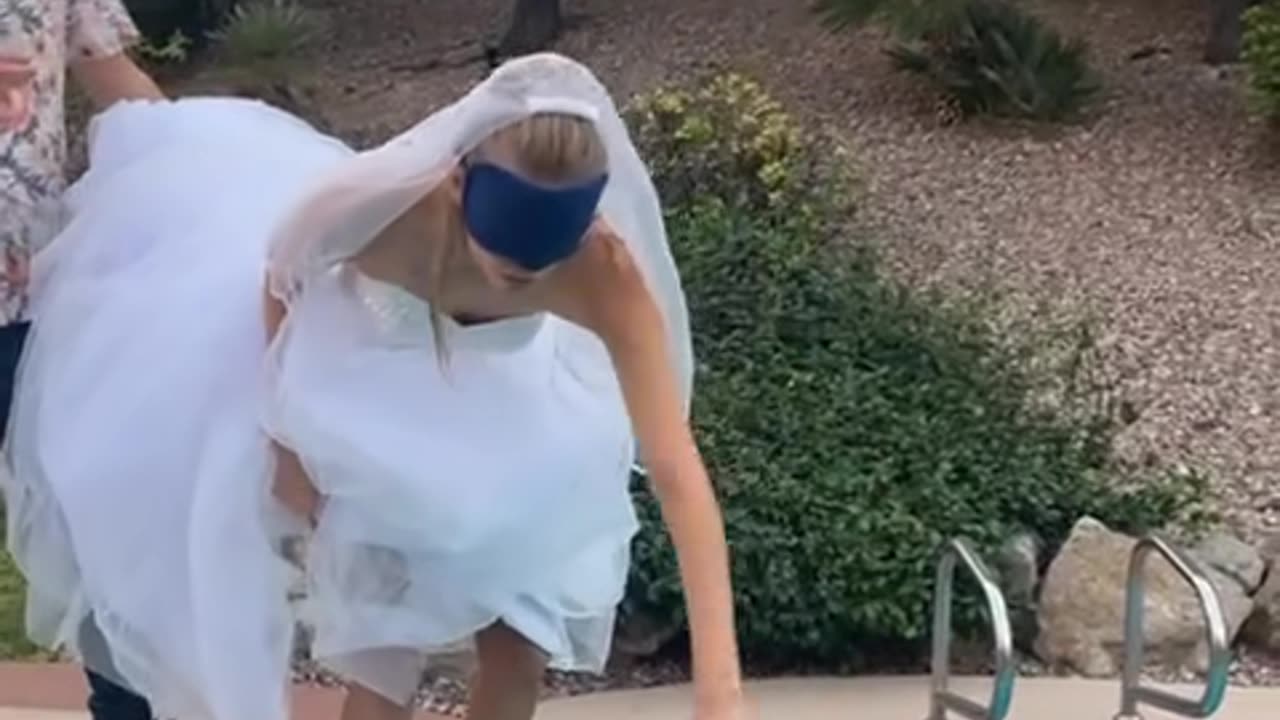 Bride doesn't know she's going in the pool