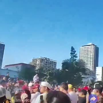 Venezuelan exiles erupting in tears of joy, chanting 'Libertad!'