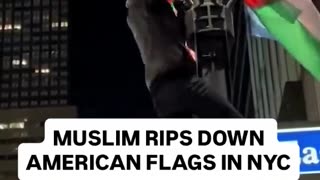 Watch how a Muslim is ripping down the American Flag in New York City.
