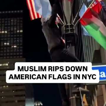 Watch how a Muslim is ripping down the American Flag in New York City.
