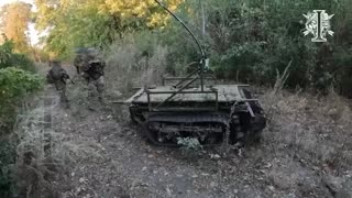 Ukrainian Soldiers Advance Behind Demining Robot