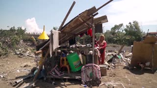 Filipino mother salvages scrap to feed family after typhoon