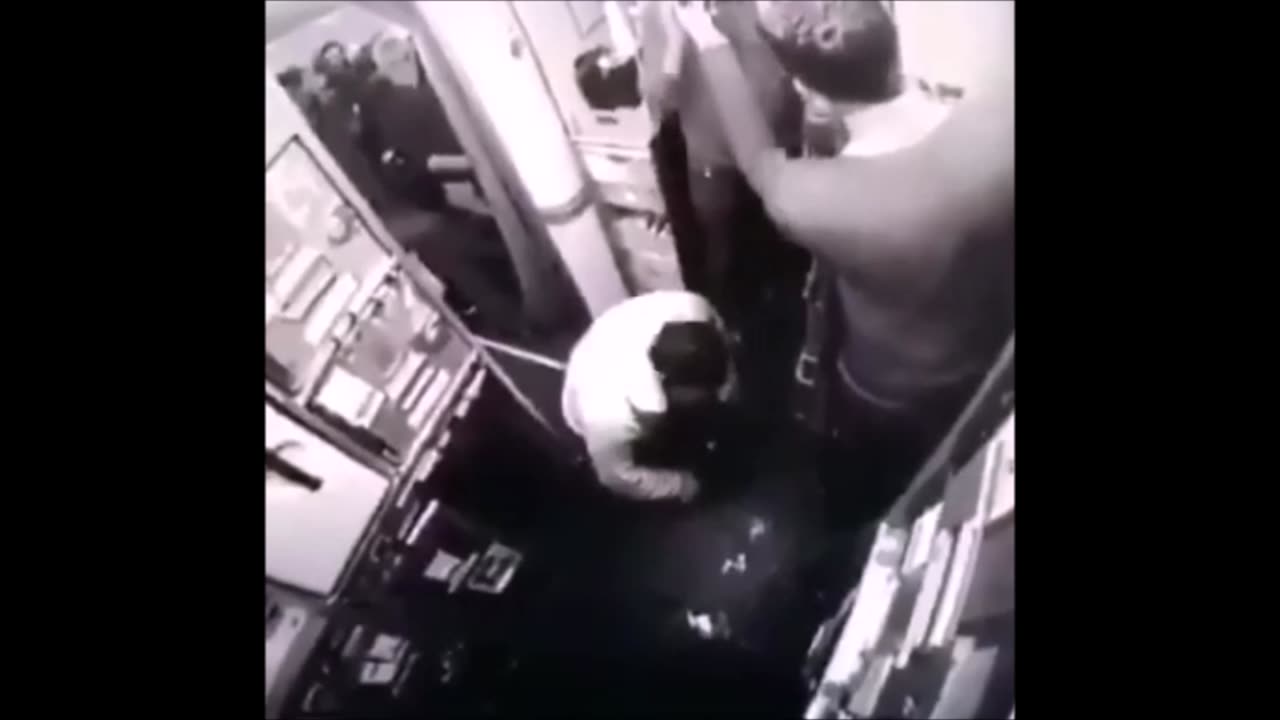Muslim man prays in the aisle of a passesenger jet