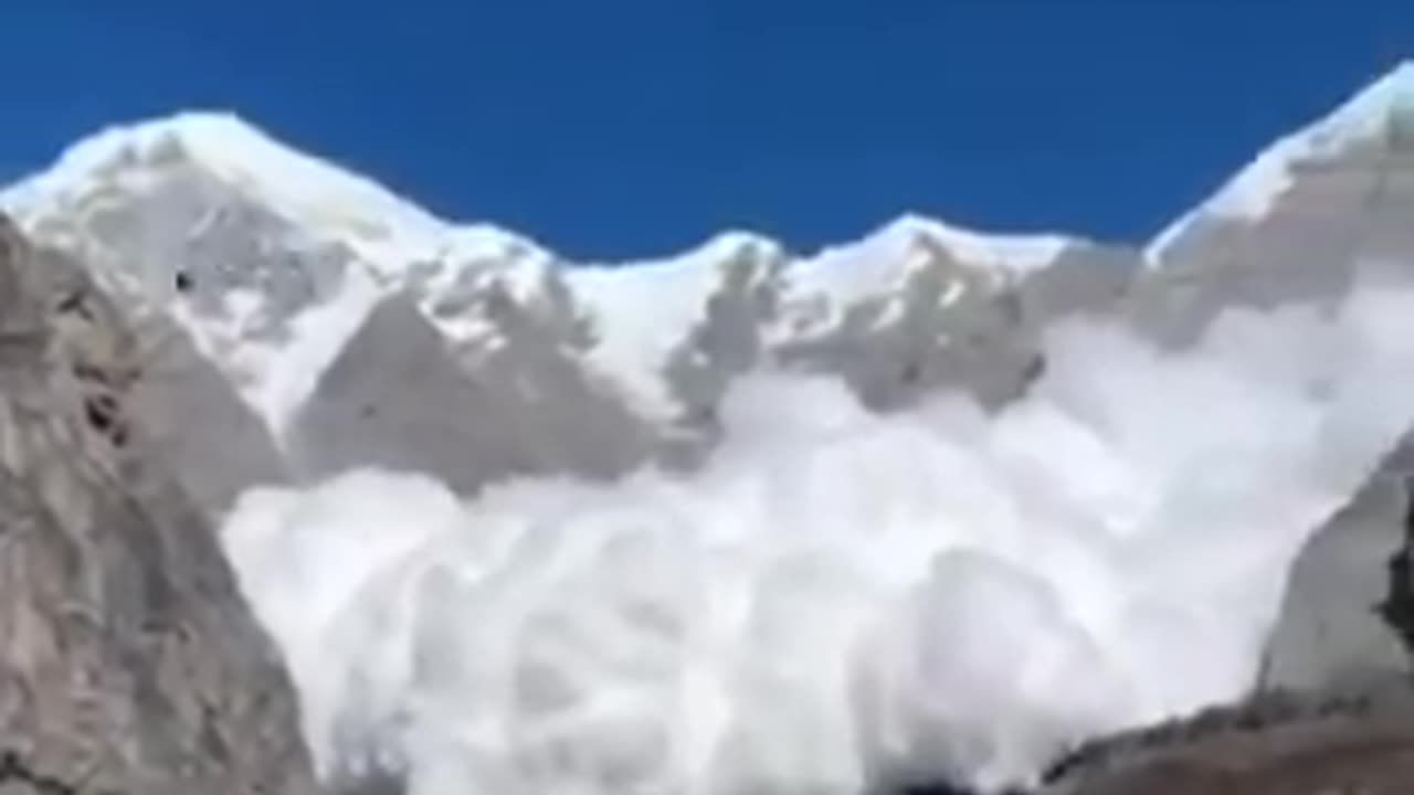 Avalanche surges down the steep face of Annapurna I in Nepal