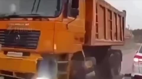 Look Both Ways While Crossing the Street(Man Hoverboards Out In Front of Dump Truck in Moscow)