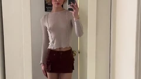 Very cute tgirl in home smiling