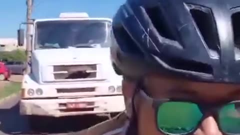 Smartass bicyclists purposely holds up traffic, blocks truck...GETS INSTANT KARMA