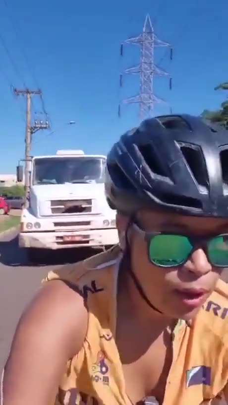 Smartass bicyclists purposely holds up traffic, blocks truck...GETS INSTANT KARMA