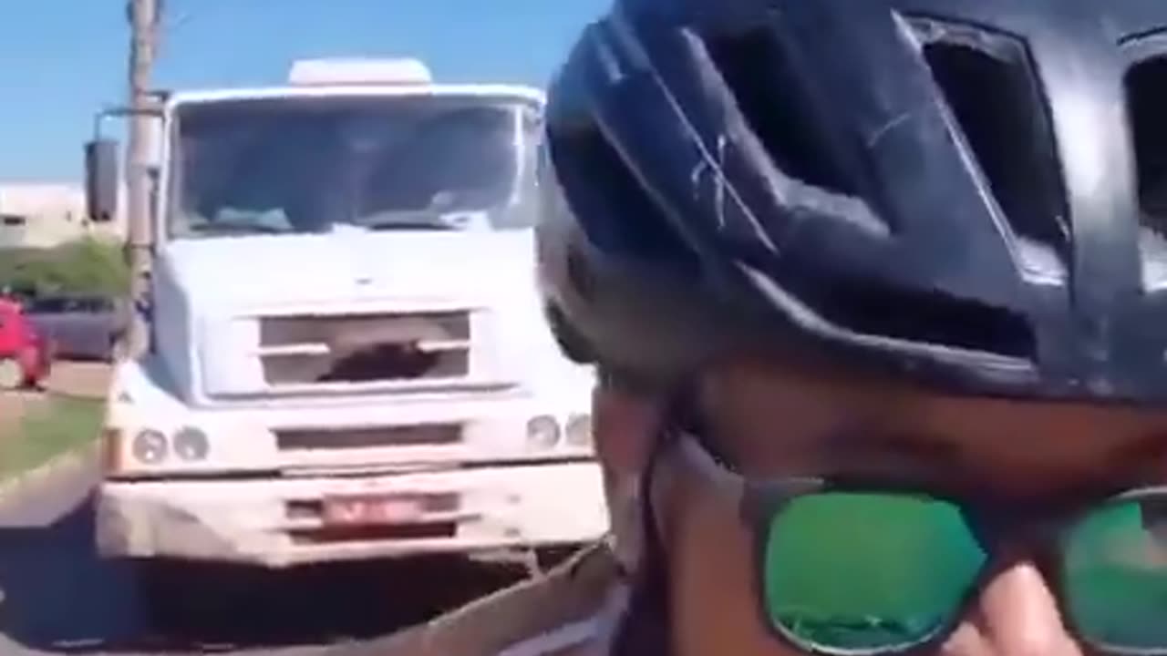 Smartass bicyclists purposely holds up traffic, blocks truck...GETS INSTANT KARMA