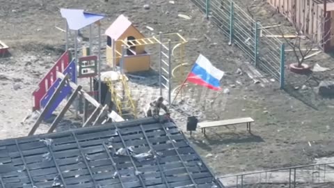 Russian troops raising flags on the outskirts of Sudzha in the Kursk region