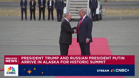 Before the Alaska summit, Trump and Putin shake hands.