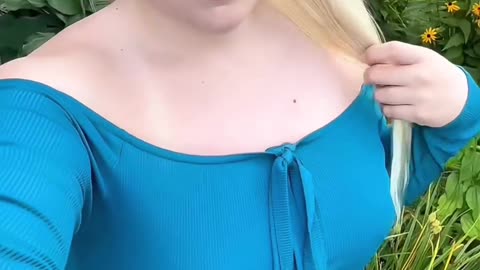 A blonde tgirl in garden