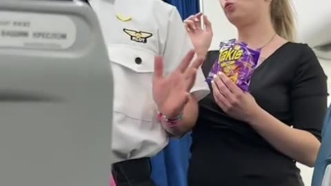 Pilot addresses his hat