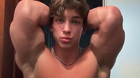 Handsome muscular man showing off his muscles